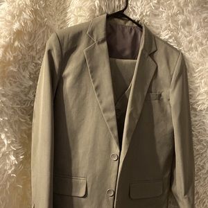 Tan three piece suit. Jacket, vest and pants.